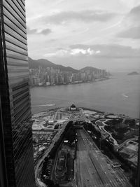 High angle view of cityscape against cloudy sky