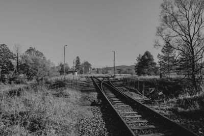 Railroad tracks against clear sky