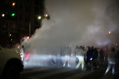 Group of people on road at night