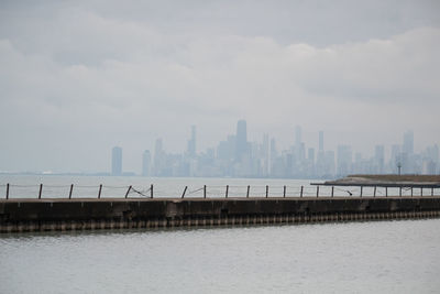 Pier over sea against sky