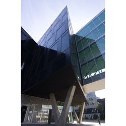 Low angle view of modern buildings against clear sky