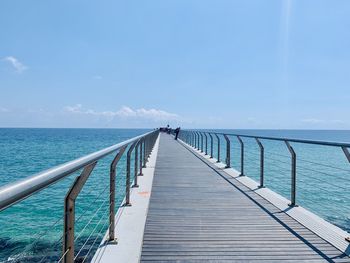 Pier over sea against sky