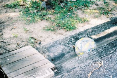 High angle view of ball on bench