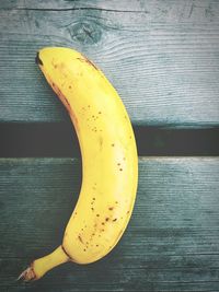 Directly above shot of yellow banana on table