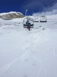 Overhead cable car in snow covered mountain