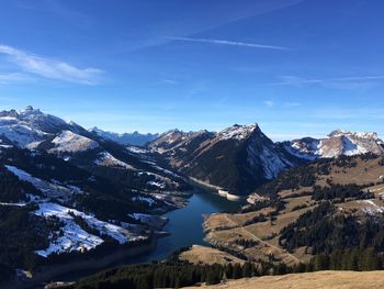 Scenic view of snowcapped mountains against sky