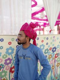 A young indian beard boy portrait photo in wedding with colorful shafa 