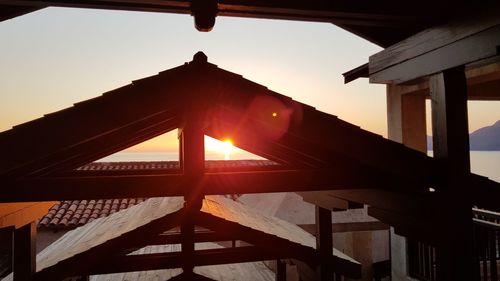 Low angle view of roof at sunset