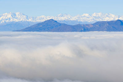 A sea of fog over the city of como and lake como, from a panoramic viewpoint in brunate.