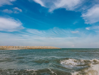 Scenic view of sea against blue sky