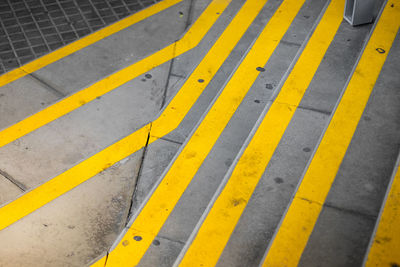 High angle view of yellow zebra crossing on road