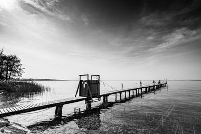 Pier over sea against sky