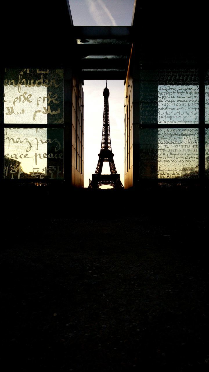 built structure, architecture, window, indoors, metal, building exterior, sky, silhouette, glass - material, no people, day, metallic, transportation, low angle view, security, sunlight, safety, building, protection