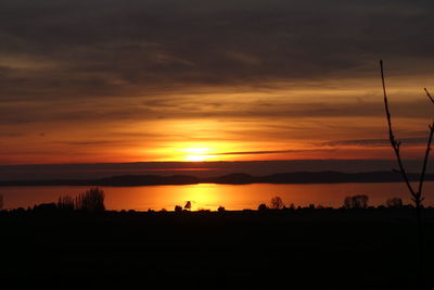 Scenic view of dramatic sky during sunset