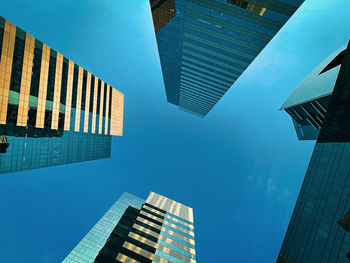 Low angle view of modern buildings against sky