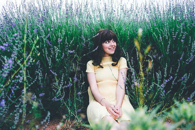 Portrait of smiling young woman on field