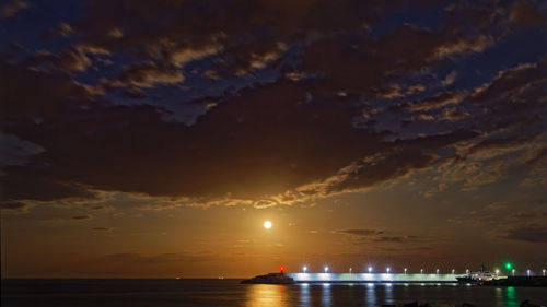 Scenic view of sea against sky at night