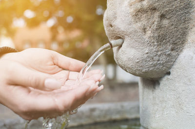 Close-up of hand holding statue