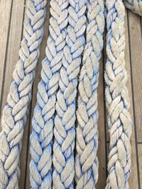 High angle view of rope tied on wood