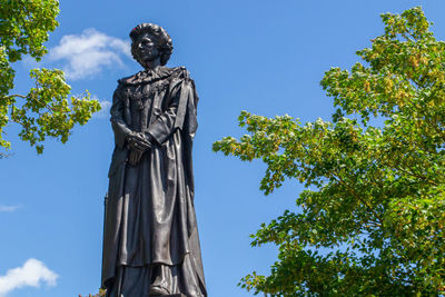 Low angle view of statue against sky