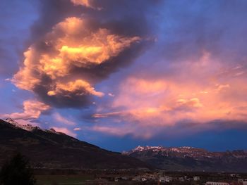 Scenic view of mountains against sky at sunset