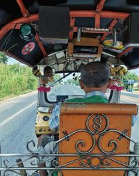 Rear view of people sitting in bus