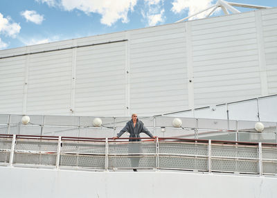 Full length of man standing on boat deck