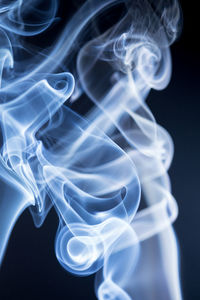 Close-up of smoke against black background