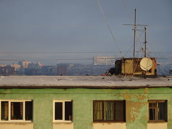 Houses against sky in city