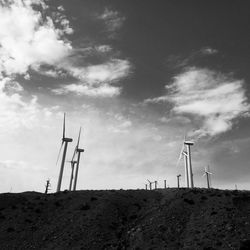 Wind turbines in field