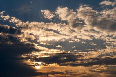 Low angle view of clouds in sky during sunset