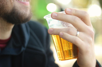 Close-up of man holding hands