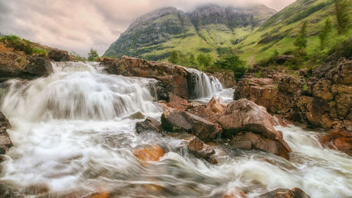 Scenic view of waterfall in forest