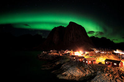 Scenic view of illuminated mountain against sky at night