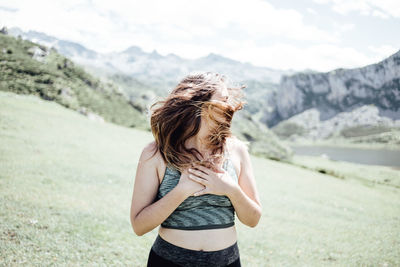 Carefree woman enjoying on mountain