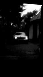 Close-up of car on road at night