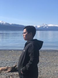 Man looking at sea against sky