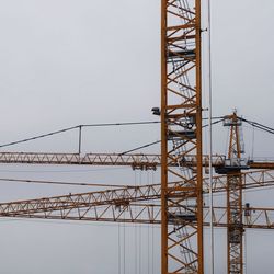 Low angle view of crane against clear sky