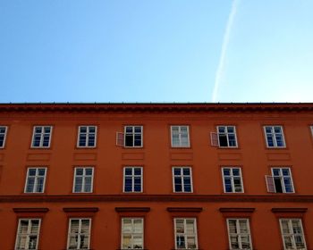 Low angle view of building against blue sky