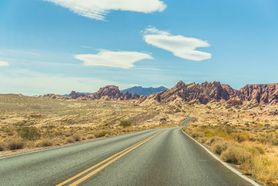 Road amidst landscape against sky