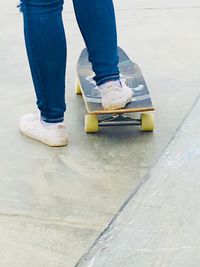 Low section of person standing on skateboard