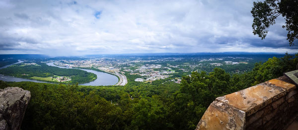 Aerial view of city and mountains against sky