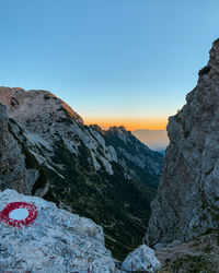 Scenic view of rocky mountains against sky during sunset