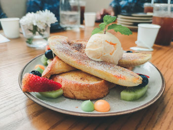 Close-up of breakfast served on table