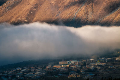 Aerial view of town against sky