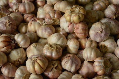 Full frame shot of garlic bulbs for sale in market