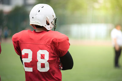 Rear view of sportsman wearing uniform