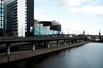 Bridge over city against sky