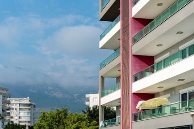 Beautiful cityscape. residential building overlooking mountains and clouds.