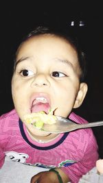 Portrait of cute boy eating food
